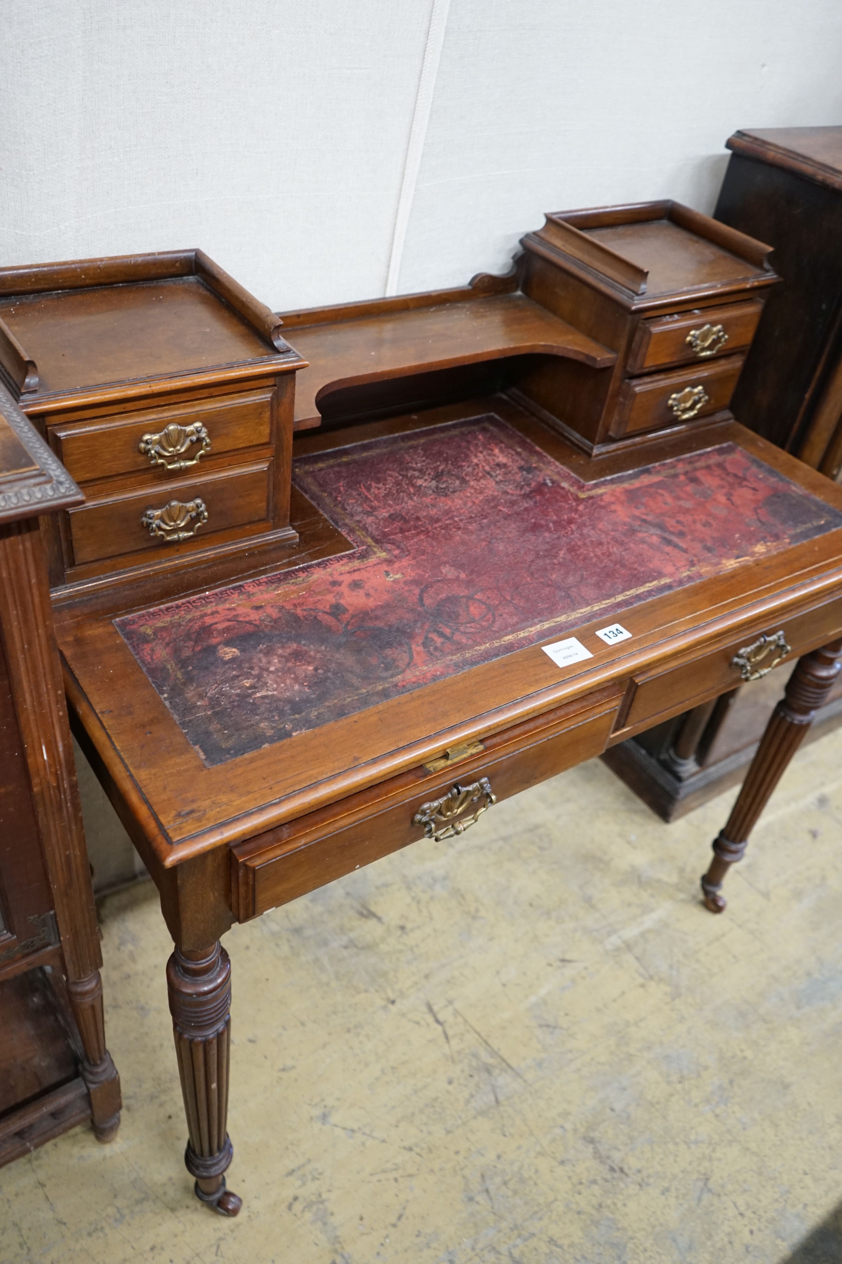 A late Victorian mahogany writing table, width 99cm, depth 52cm, height 100cm